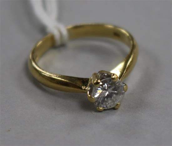 An 18ct gold and solitaire diamond ring, size K.